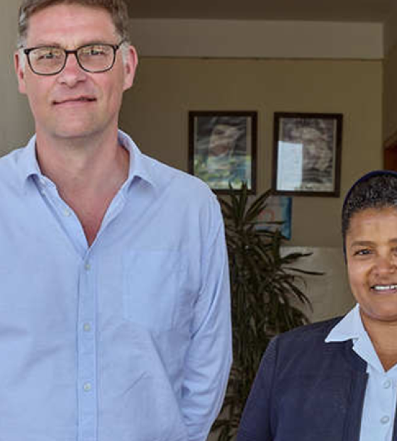 Gebrisha standing with Alex Keay & Magnus MacFarlane-Barrow of Mary's Meals, as well as Sister Medhin from our partner Daughters of Charity in Ethiopia. 