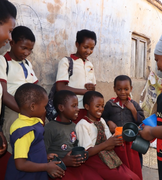 Vumiliya preparing her children for school.
