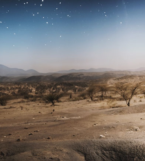 A father walks with his child in Turkana, Kenya