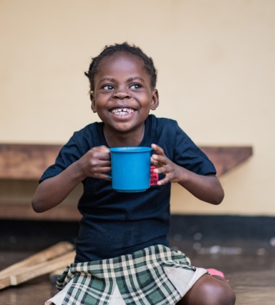 Boy eating Mary's Meals