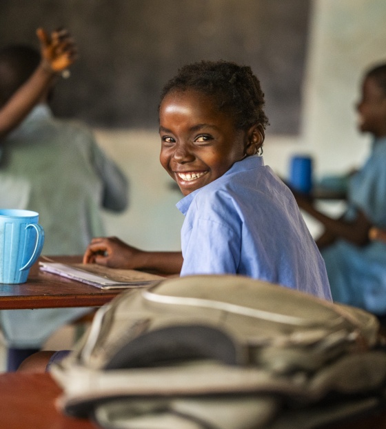2023 - Zambia - A girl smiling, happy to be in class 