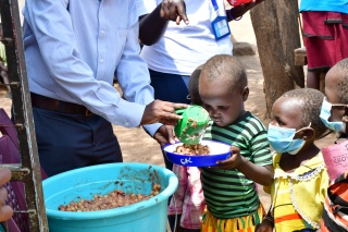 A child being served food in Kenya