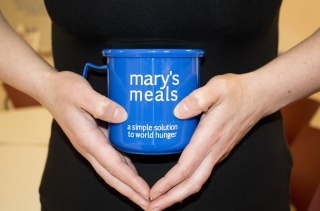 close-up of a blue Mary's Meals mug