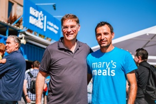 Ivan Dodig and Magnus MacFarlane-Barrow, founder of Mary's Meals smiling for a photo.