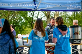 A group of fundraising standing at a stall raising money for Mary's Meals.