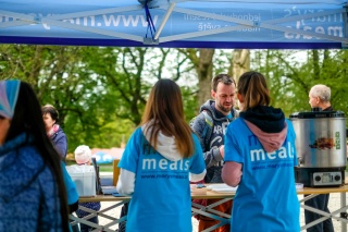 A group of fundraising standing at a stall raising money for Mary's Meals.