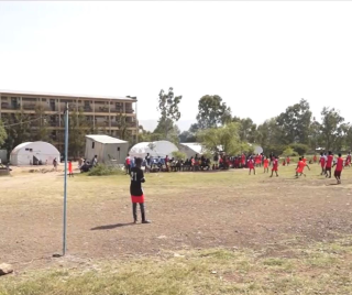 15-year-old Nohe from Ethiopia plays football in the IDP centre.
