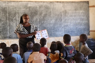 Children in class learning with their teacher in Turkana, Kenya.