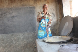 Agnes, a volunteer cook in her kitchen in Malawi. 