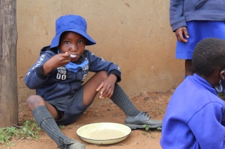 2022 - Zimbabwe - child enjoying bowl of food 