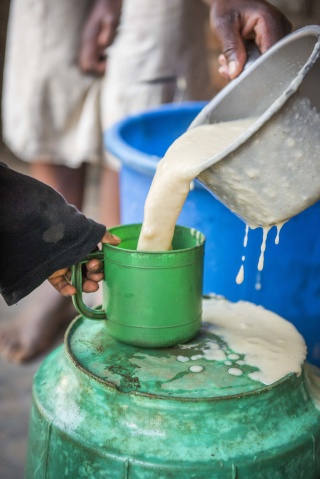 porridge being poured into a mug