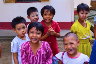 Children gather together outside school