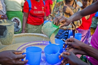 Food is served by volunteers in Zambia