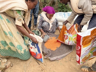 Volunteer cooks preparing meals.