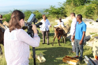 Image of a camera woman filming a Mary's Meals film.