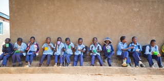Zambia 10th – children sitting in a line