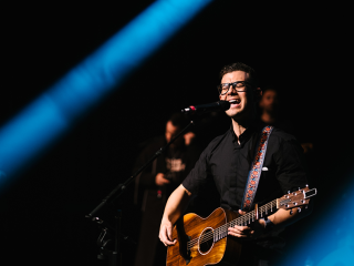 Image of Fr Rob Galea performing in concert.