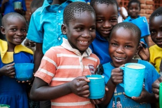 Children in Malawi eating Mary's Meals