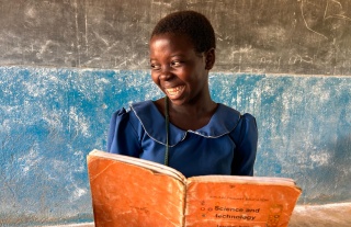 2025 - Malawi - Child reading in class 